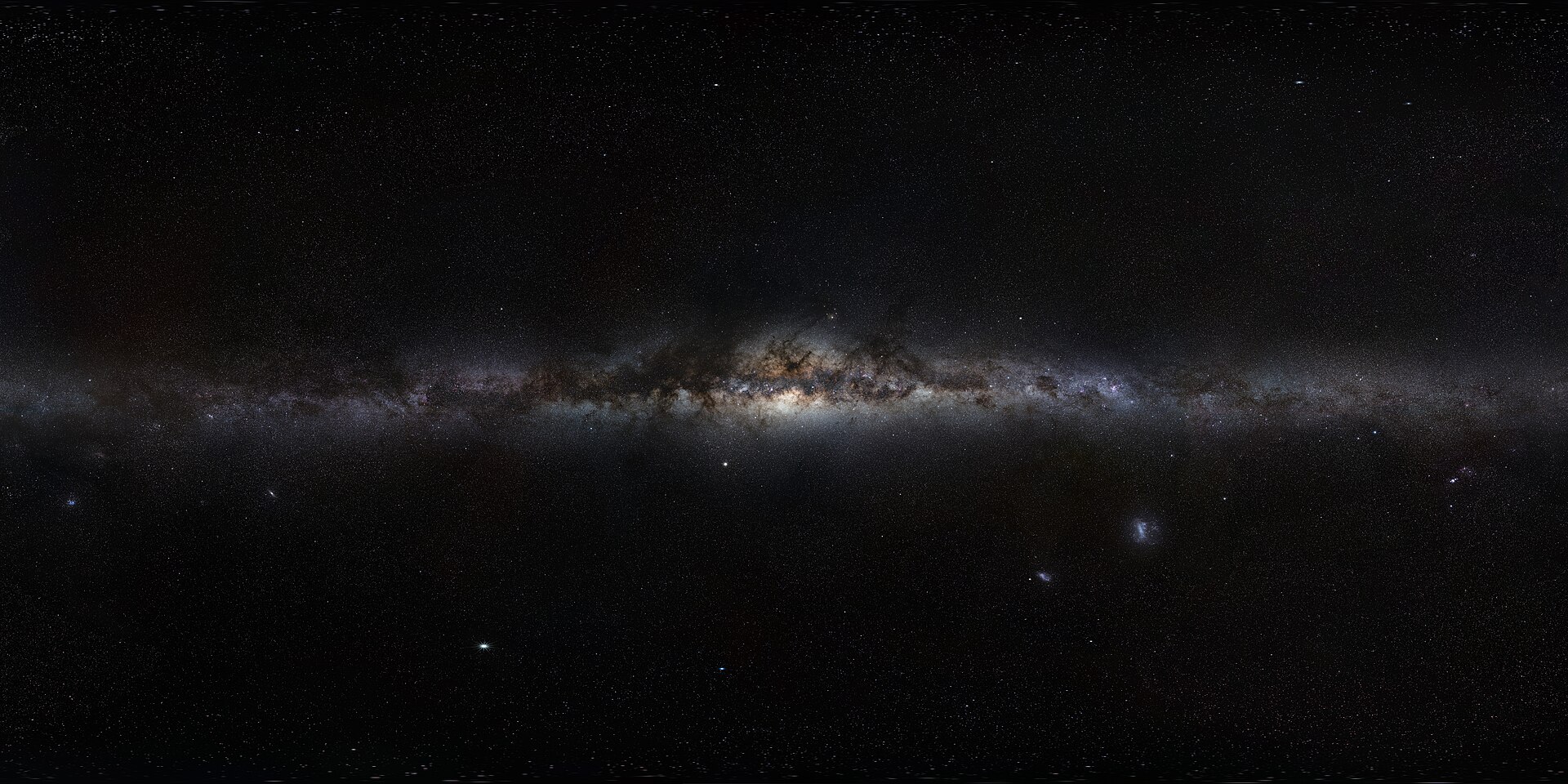 The Milky Way arching over a dark landscape, photographed by the European Southern Observatory